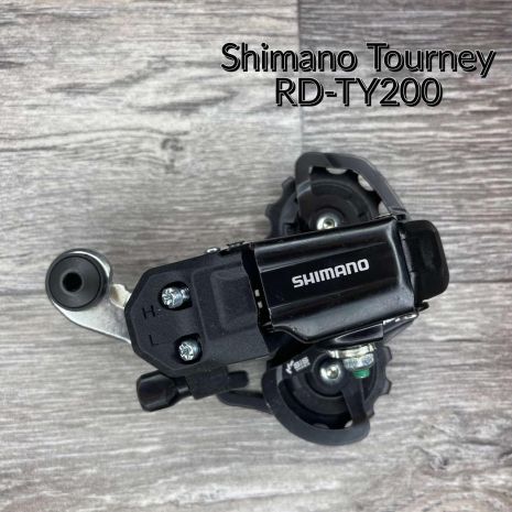 Задний переключатель Shimano Tourney RD-TY200-SS-D 6/7-speed, короткая лапка, под болт, на петух, RDTY200SSLD